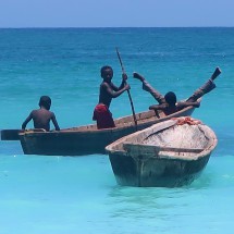 Boys playing in a little boat